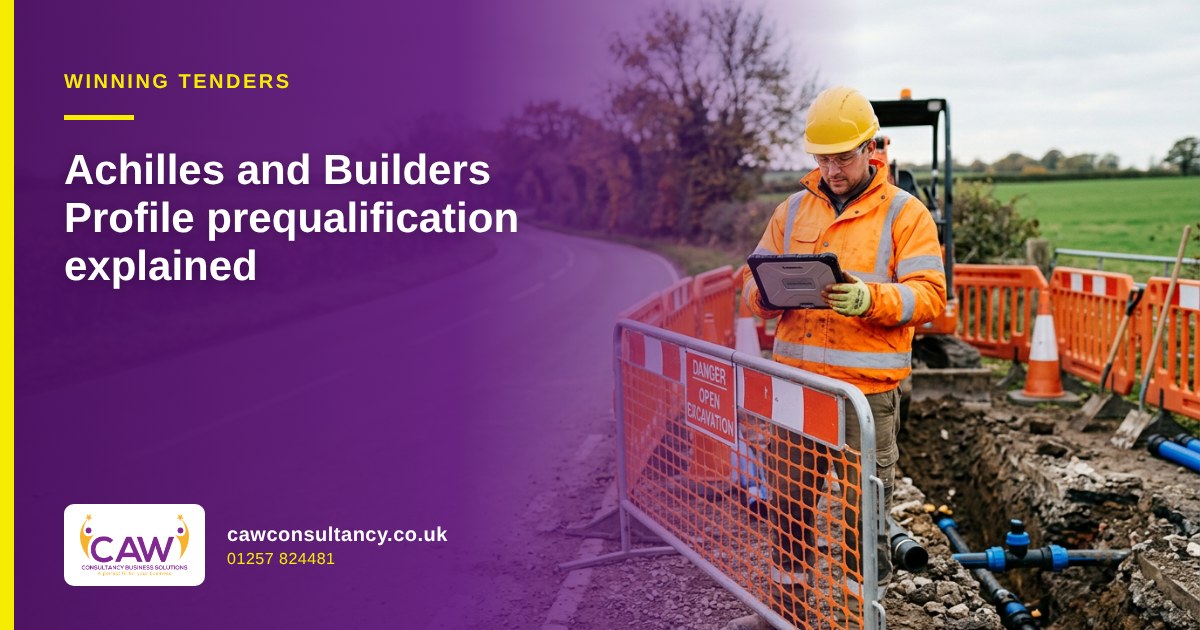 Utility contractor in hi-vis checking a tablet beside a roadside excavation