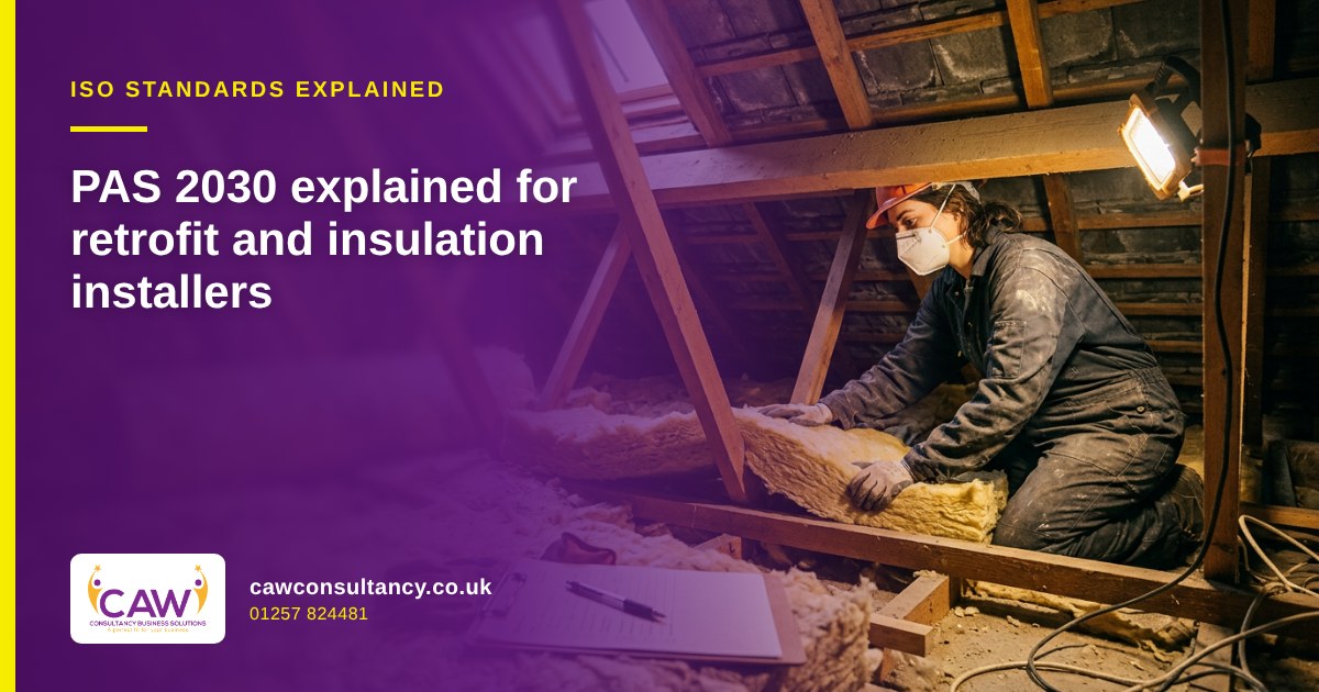Installer fitting mineral wool insulation in a loft